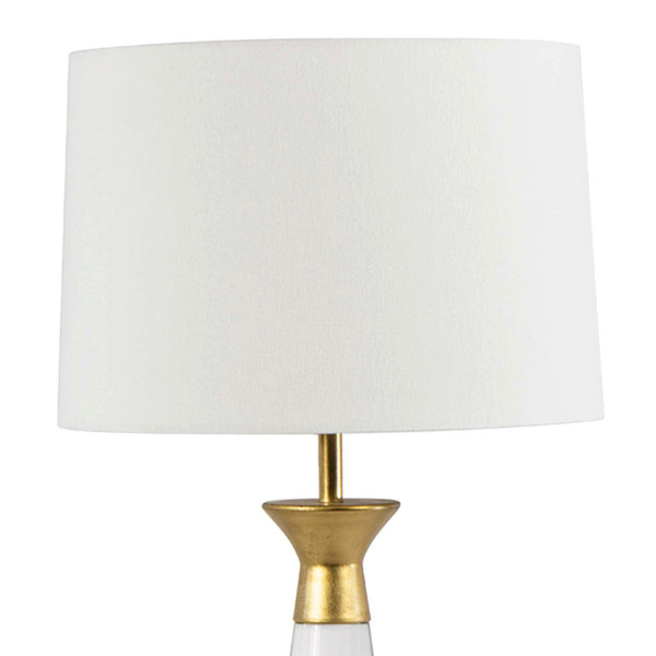 Crystal lamp with gold finishing and a white linen shade